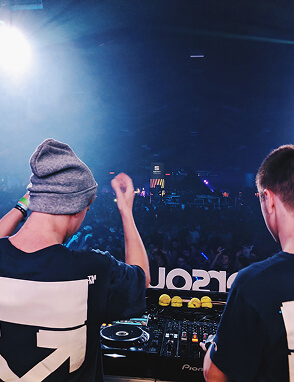 DJ at a concert with hands up
