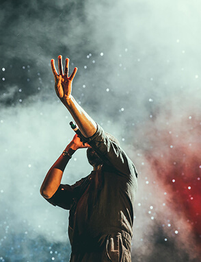 Singer on stage with smoke